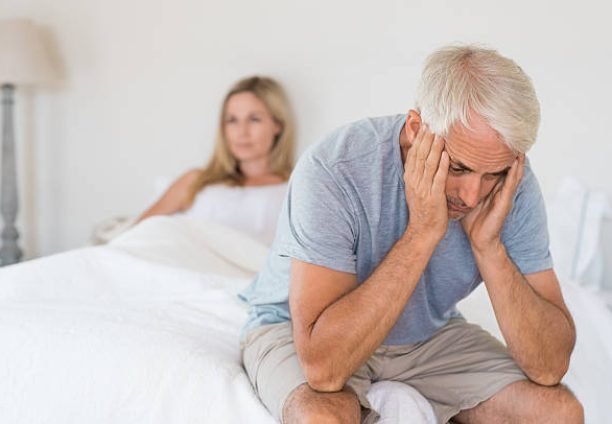 Upset mature couple ignoring each other. Close up of a worried senior man in tension at bed. Senior couple angry with each other after a fight.